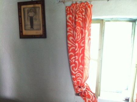 Bedroom window - with a photo of my grandfather on the wall.