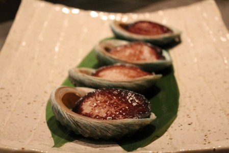 Live Tasmanian abalone squirming around in their shells.