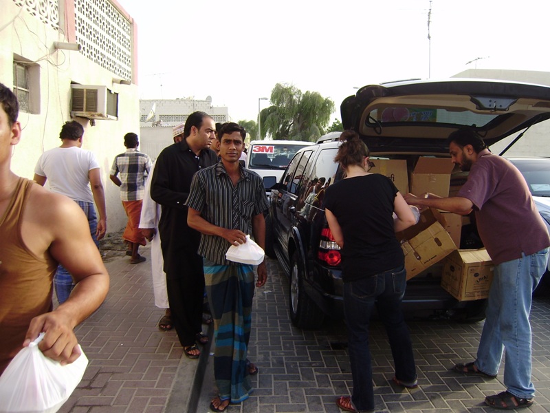 Trying to balance all the boxes in the car with Mridul's help.