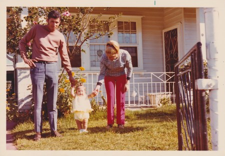Devoted parents to a little butterball.  Aw!!