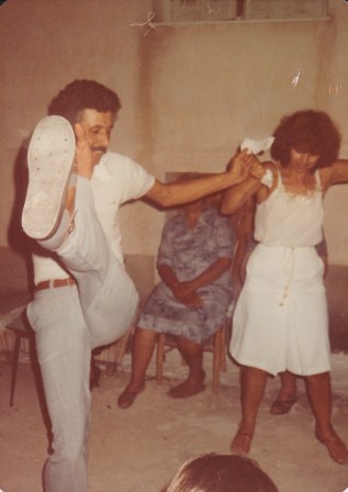 Sharing the handkerchief with his sister Toula.  Excuse me, but the man can KICK!!!!